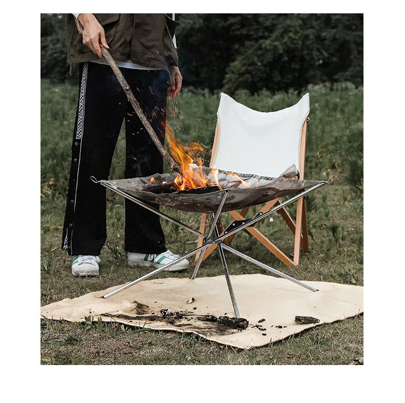 Silver stainless steel barbecue grill with matching cooking net, large size for group use.