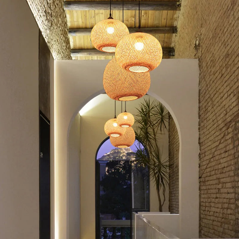 Zen-style pastoral ceiling chandelier with a woven natural rattan lampshade.
