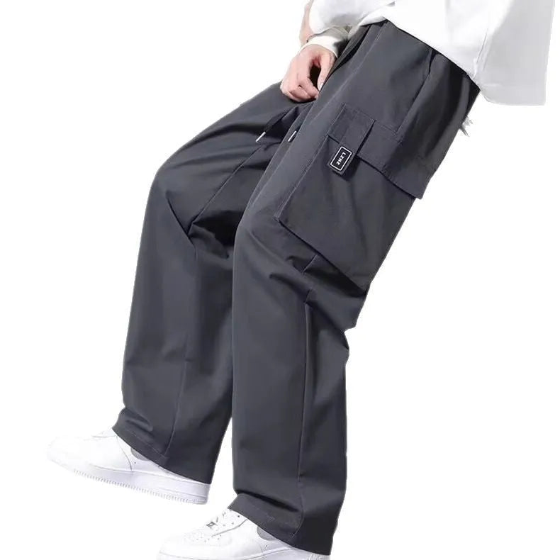 Boys straight leg cargo trousers with drawstring waist and large pockets in polyester fabric