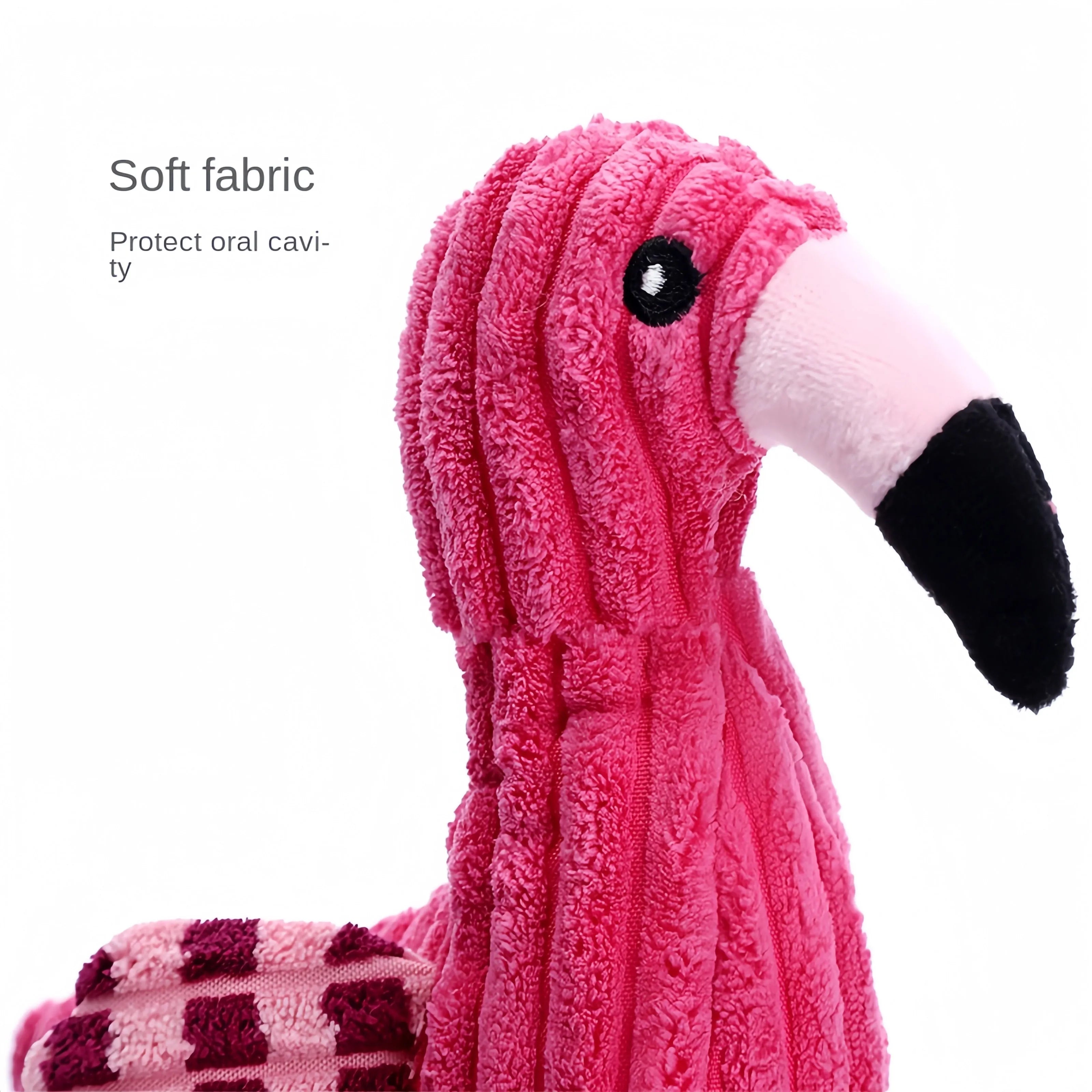 Pink corduroy animal-shaped plush dog toy with squeaker on a neutral background.