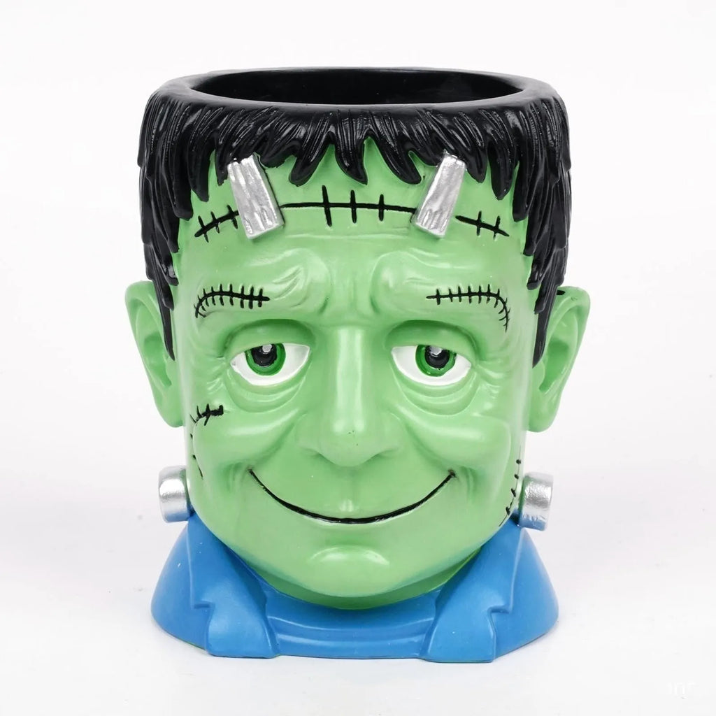 Four hand-painted Halloween cartoon resin flower pots showing bandage zombie, white ghost, Frankenstein, and death designs.