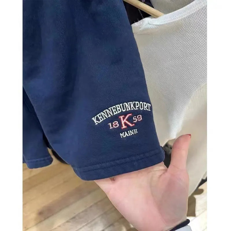 Women's dark blue cotton high-top sports shorts with white flag embroidery, shown in a free size fit.