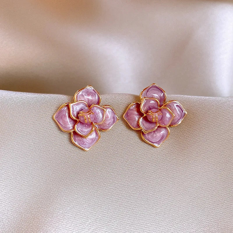 Gold plated copper flower stud earrings with oil-spot glaze in golden-purple colour
