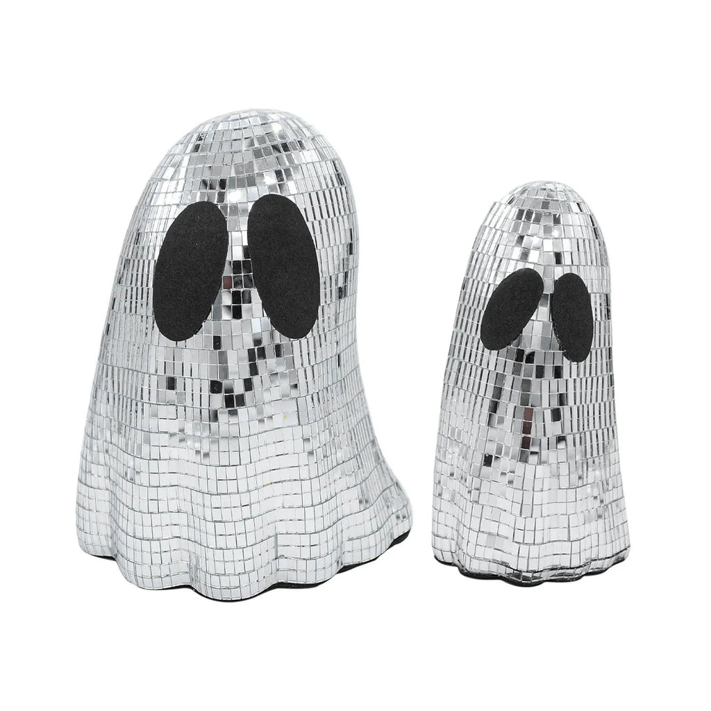 Silver glass Halloween ghost mosaic desktop decoration on a dark surface.