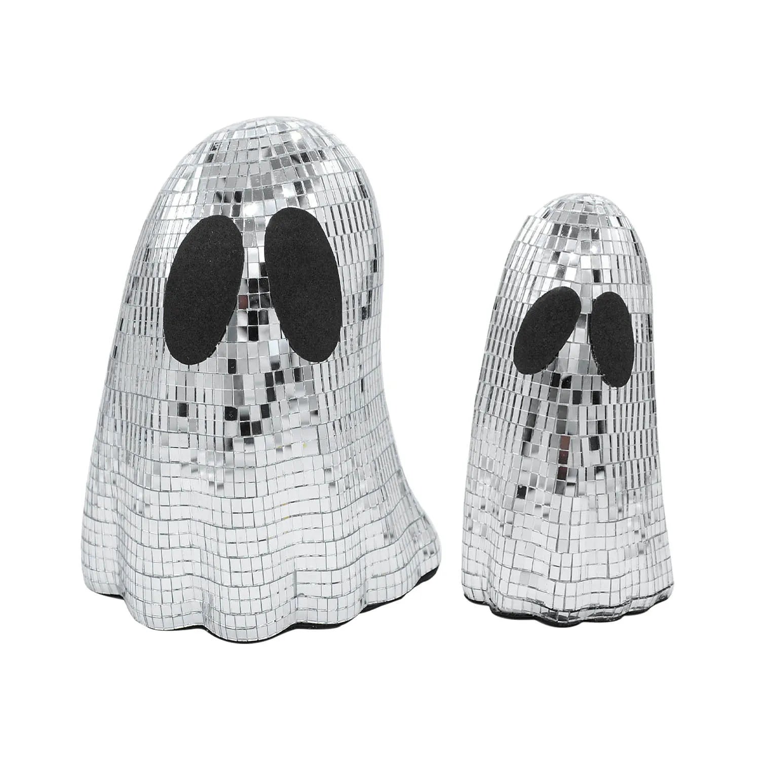 Silver glass Halloween ghost mosaic desktop decoration on a dark surface.
