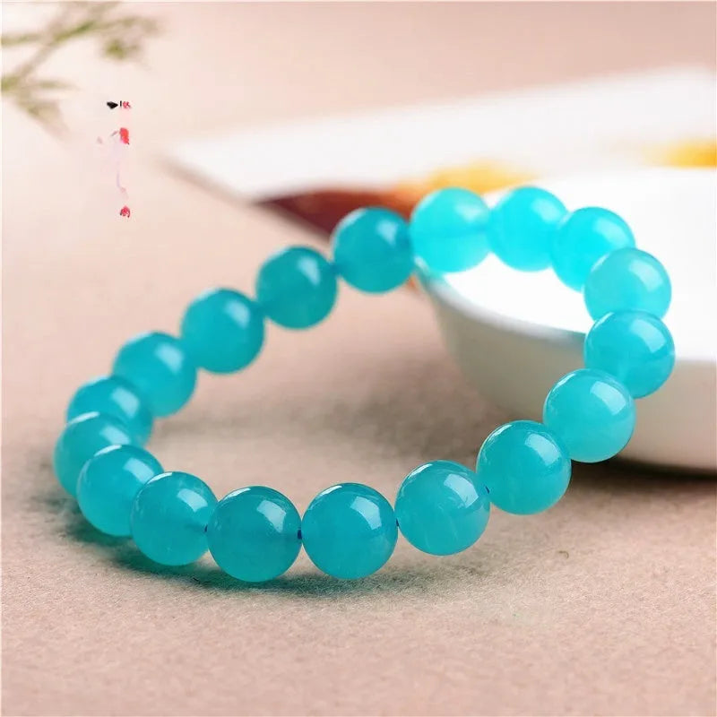 Natural amazonite scattered beads in ice colour grades for jewellery making, showing polished surfaces and size variations