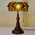 10-inch tall Tiffany table lamp with multi-coloured stained glass shade on a resin base.
