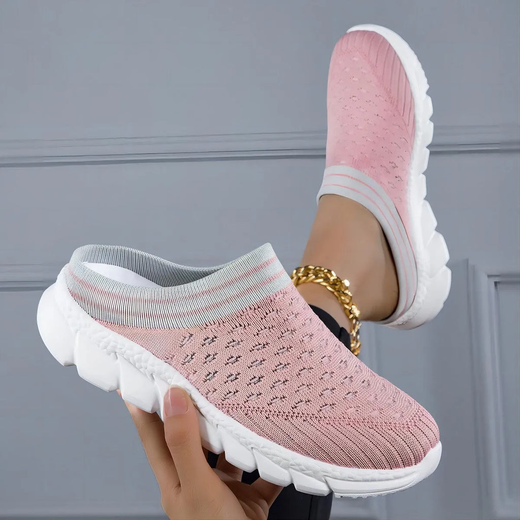 Women's black Flyknit semi-slipper shoe with striped pattern and raised sole