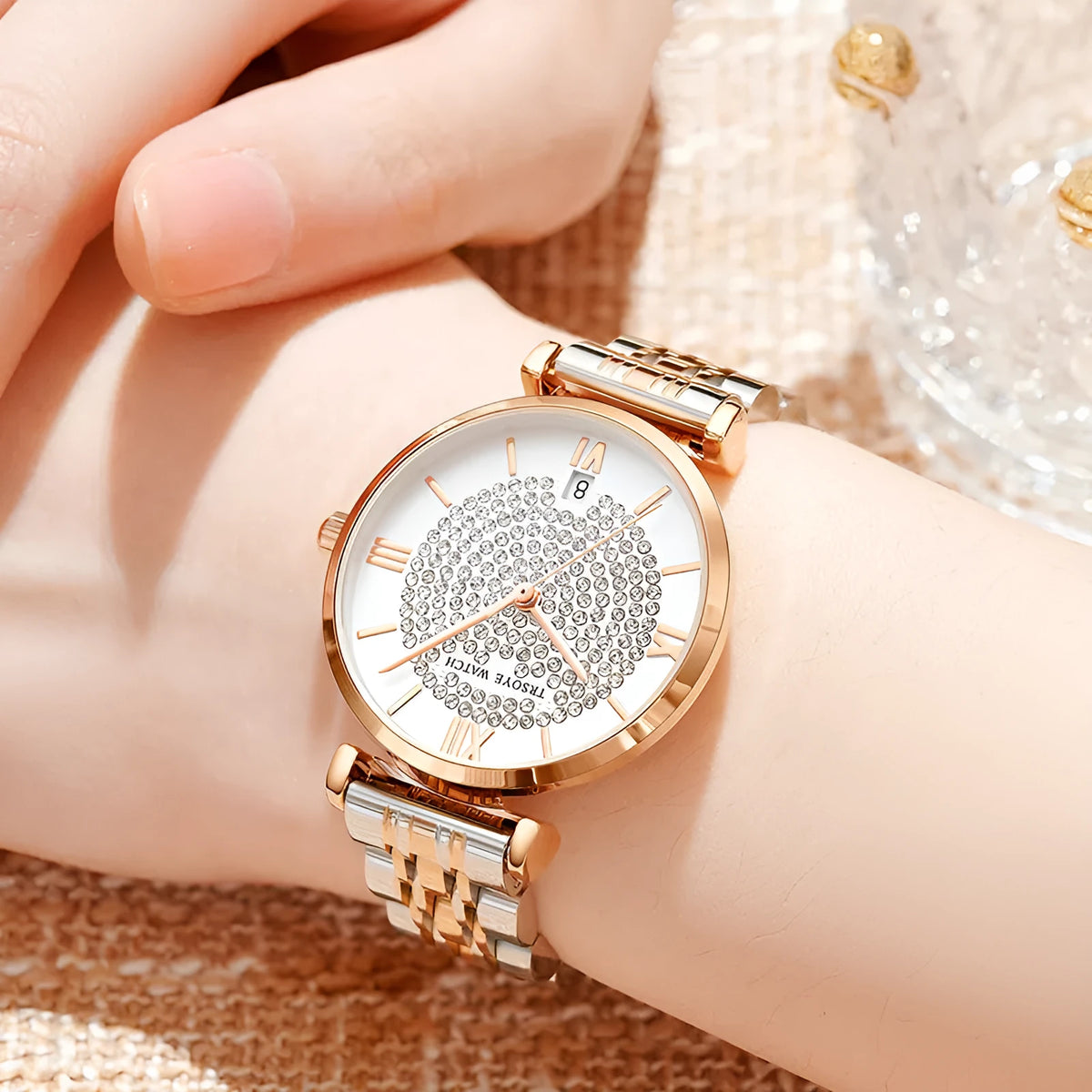 Starry women's quartz watch with 33mm dial, alloy strap, mineral glass mirror, and butterfly buckle on white background
