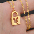 Shiny alloy key lock pendant necklace with geometric shape and electroplated finish on white background