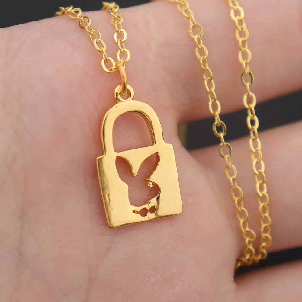 Shiny alloy key lock pendant necklace with geometric shape and electroplated finish on white background