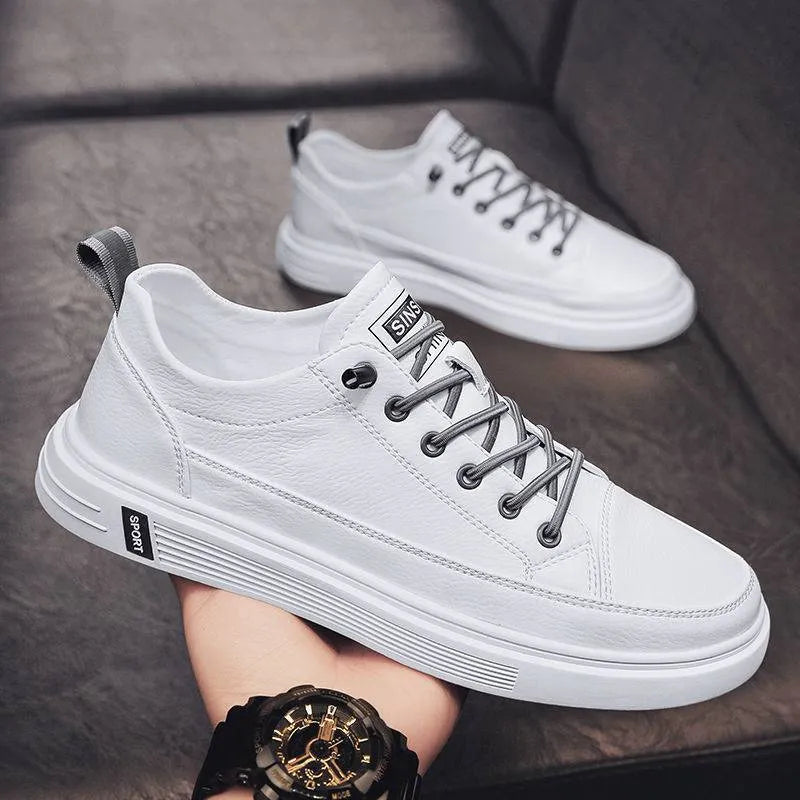Men's white casual shoes with round toe, flat bottom, and shallow opening
