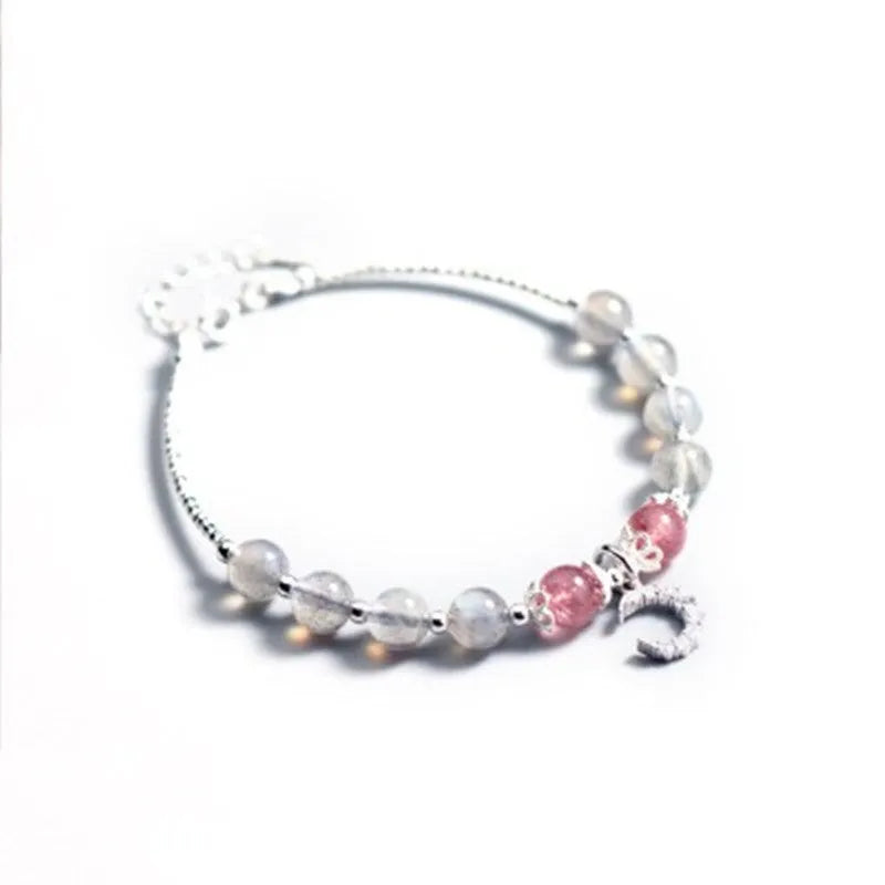 Handmade adjustable bracelet with a natural moonstone centre on a silver-toned chain.