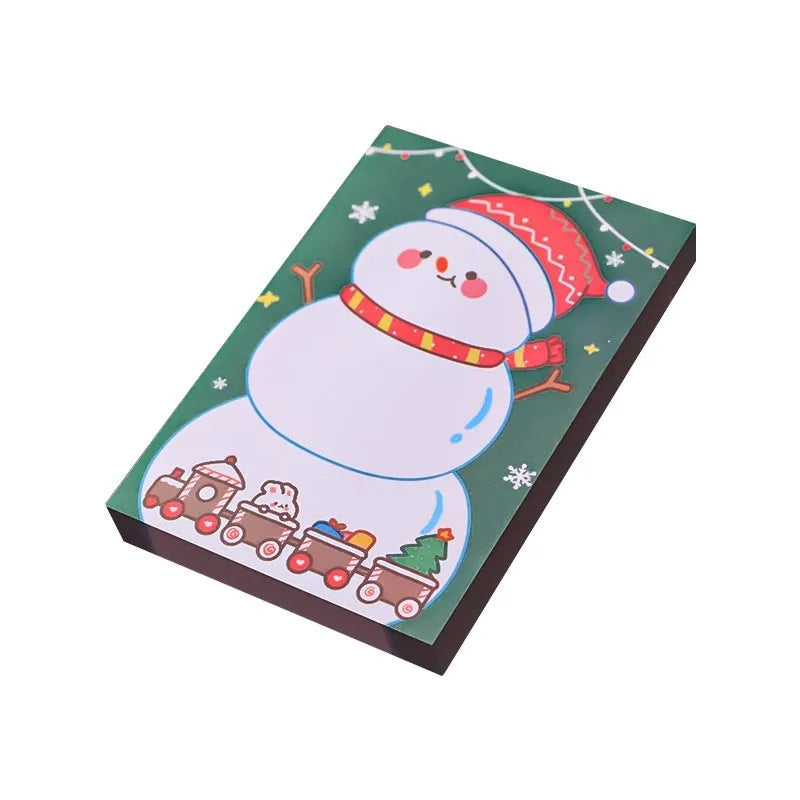 Christmas cartoon sticky notes pad showing eight festive designs including Santa Claus, snowman, and Christmas elf