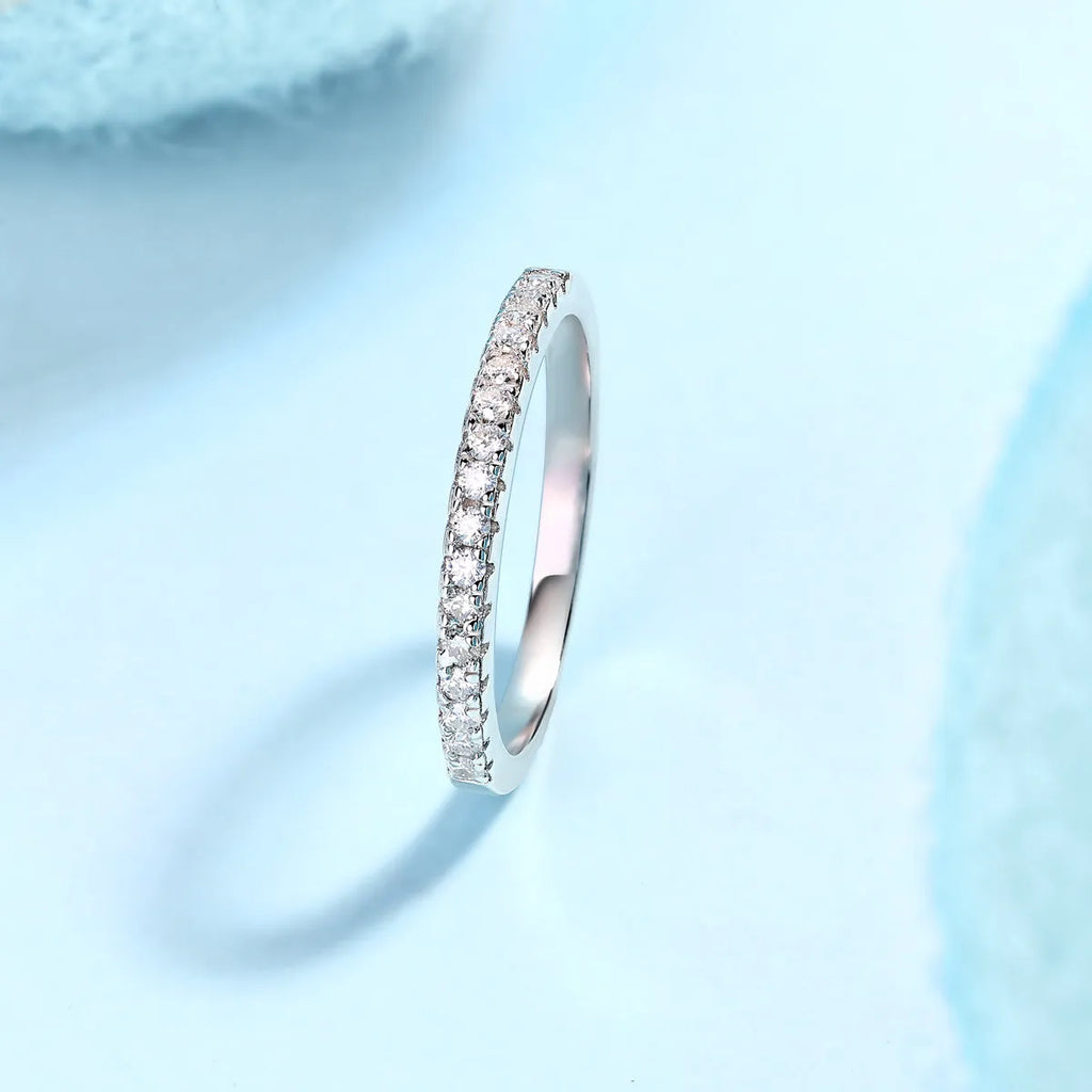Parallel World moissanite wedding ring set in gold and rose gold on a gift box