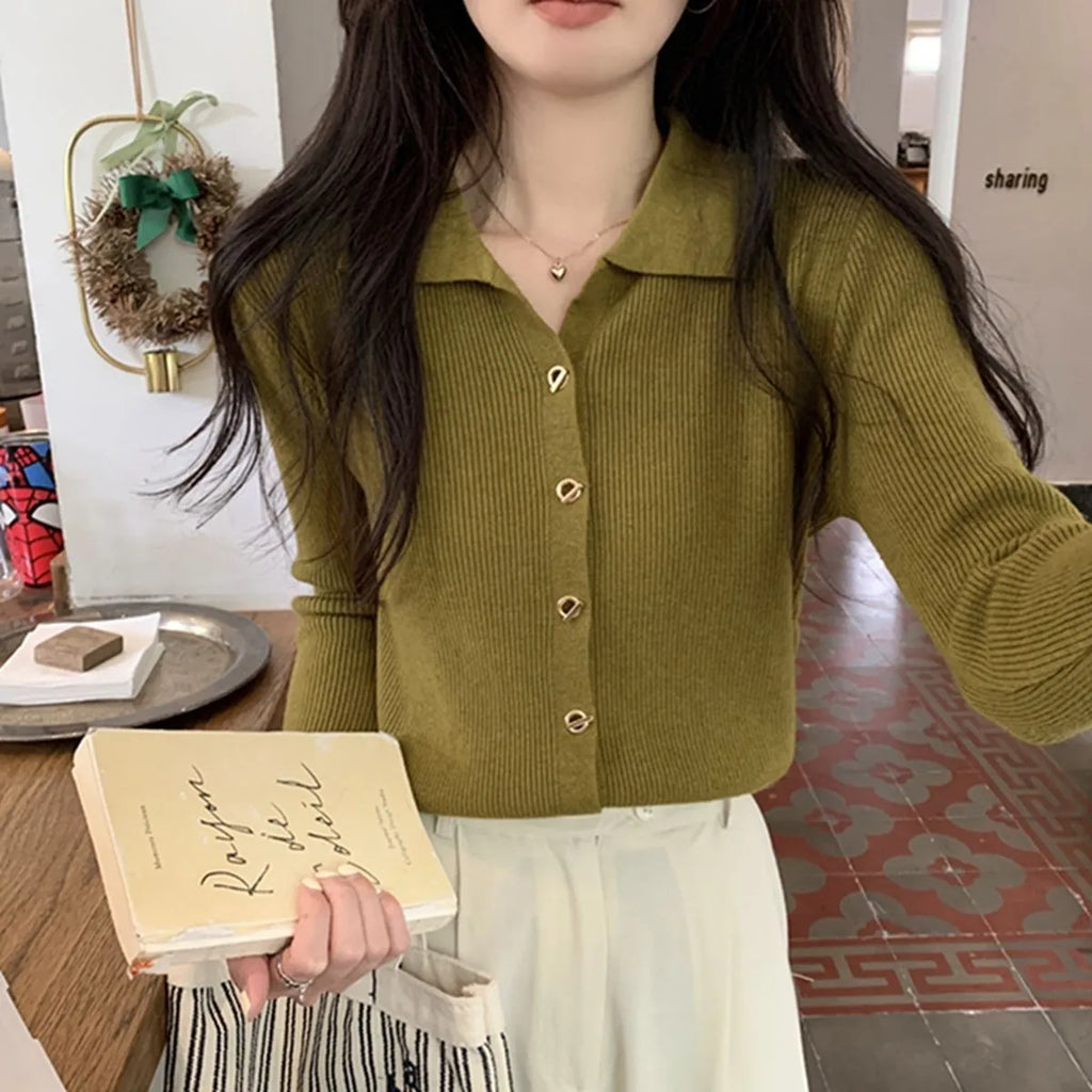 Beige loose-fit long-sleeve viscose knitted cardigan shown on a hanger.