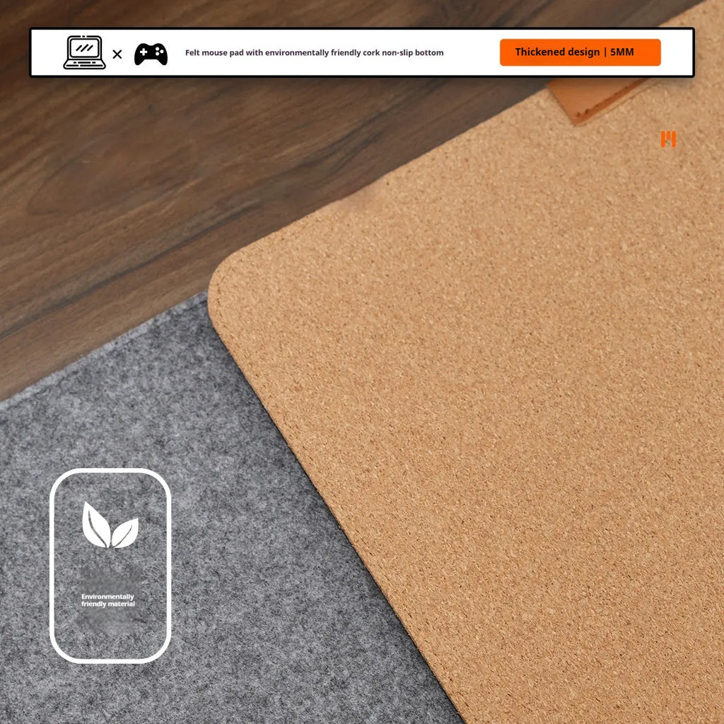 A winter warm felt cork office desk mat in a grey colour pattern, shown on a wooden desk with a mouse.
