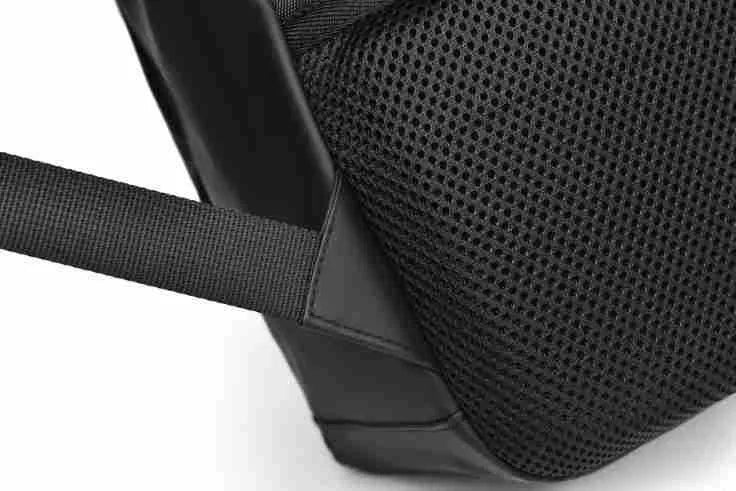 Men's large capacity waterproof backpack in black colour showing PU leather construction and computer bag accommodation