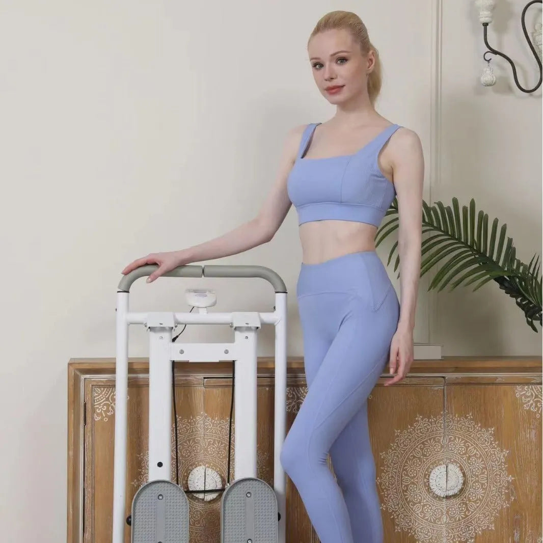 White folding treadmill with integrated climbing bars for home fitness