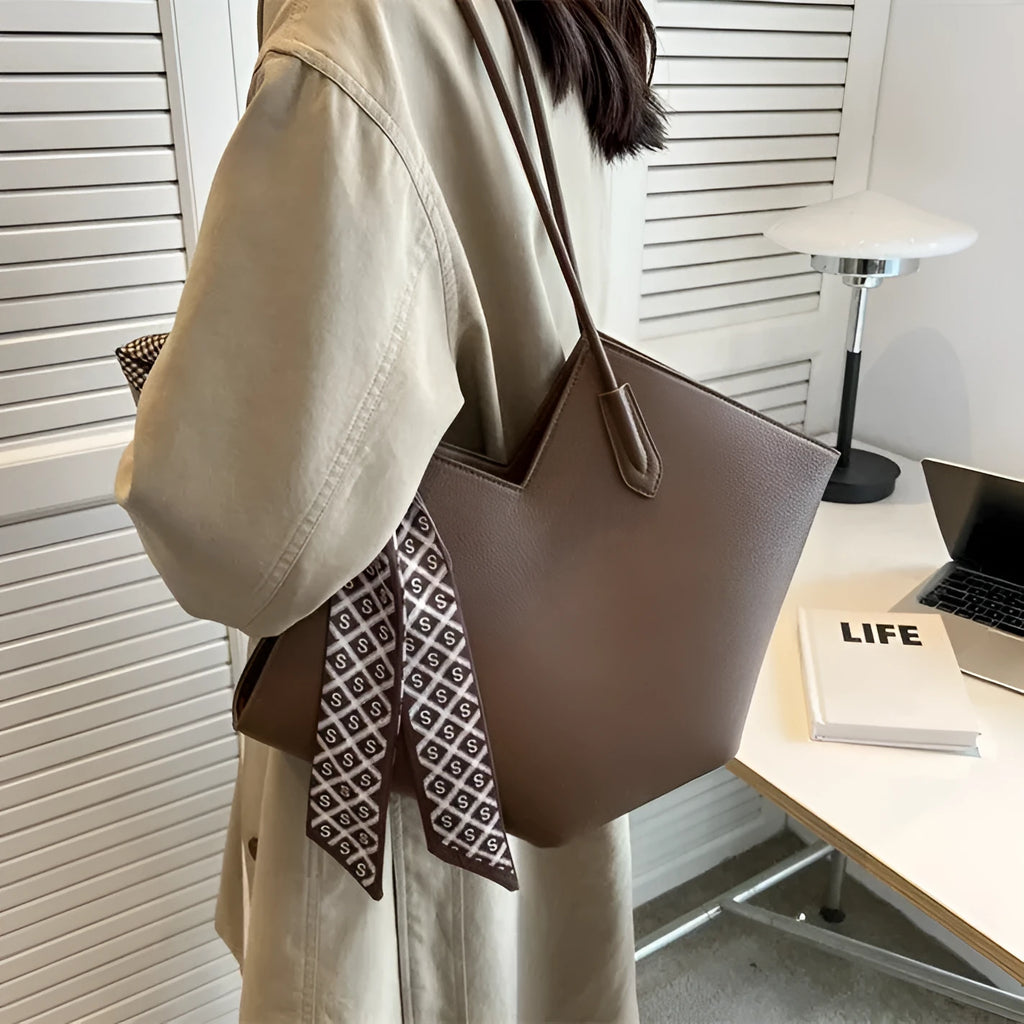 Large brown PU leather women's shoulder bag with square shape and top handle.