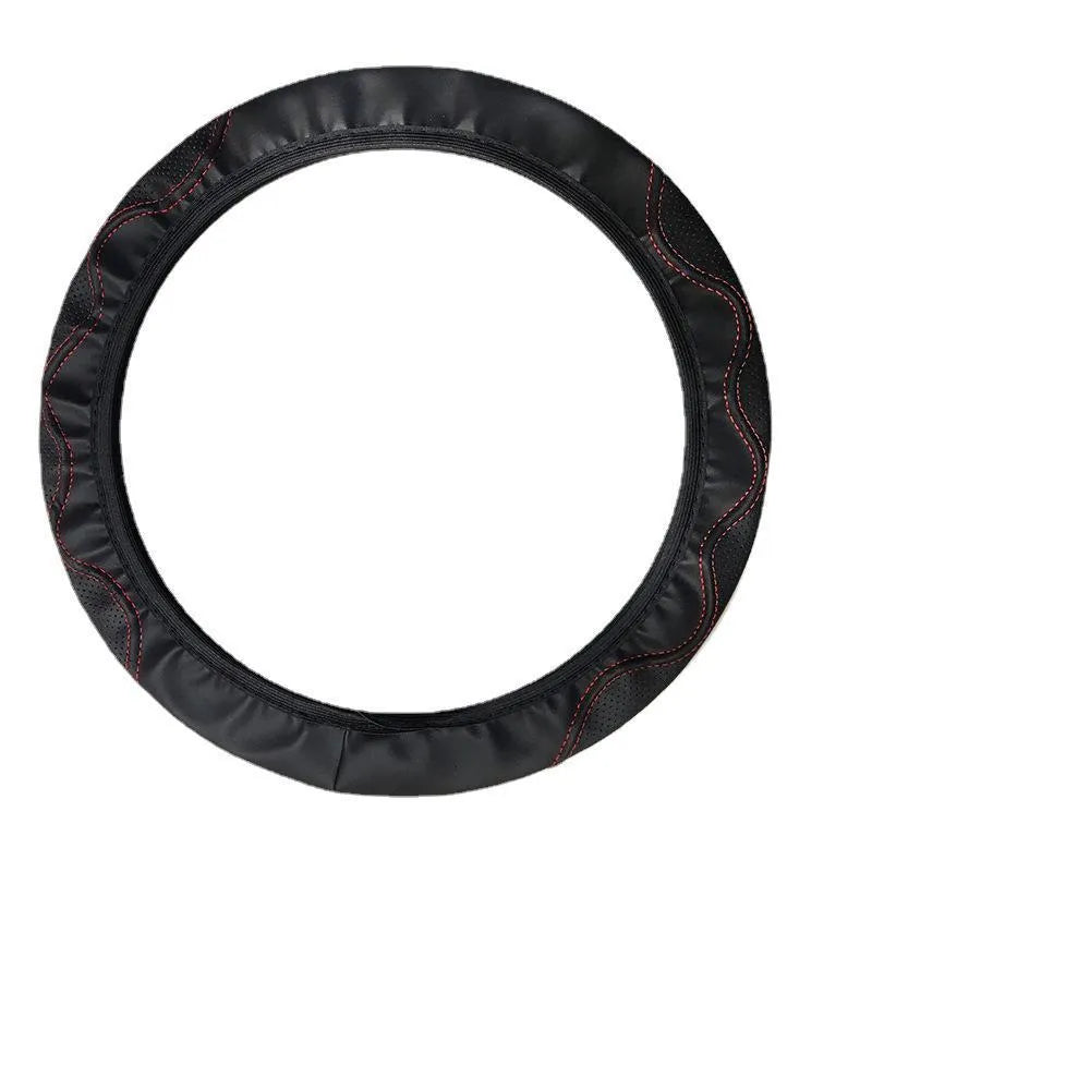 Close-up of a black corrugated elastic steering wheel cover on a car wheel.