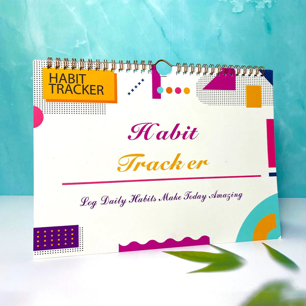 12-page habit tracking journal in pink and white, showing its 21cm by 28cm size.