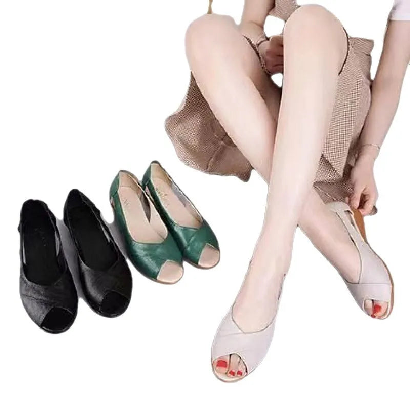 Women's black peep toe sandals with an ankle buckle and rubber sole, shown from the side.