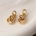 Geometric gold-colour copper earrings with irregular asymmetric design for women
