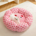 Pink dot pattern fabric cat bed shown in 45cm and 65cm diameter sizes