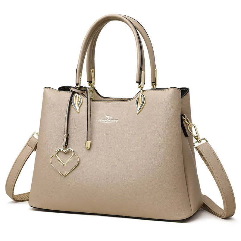 Women's black PU messenger bag with multi-layer shoulder strap and sewing thread detailing