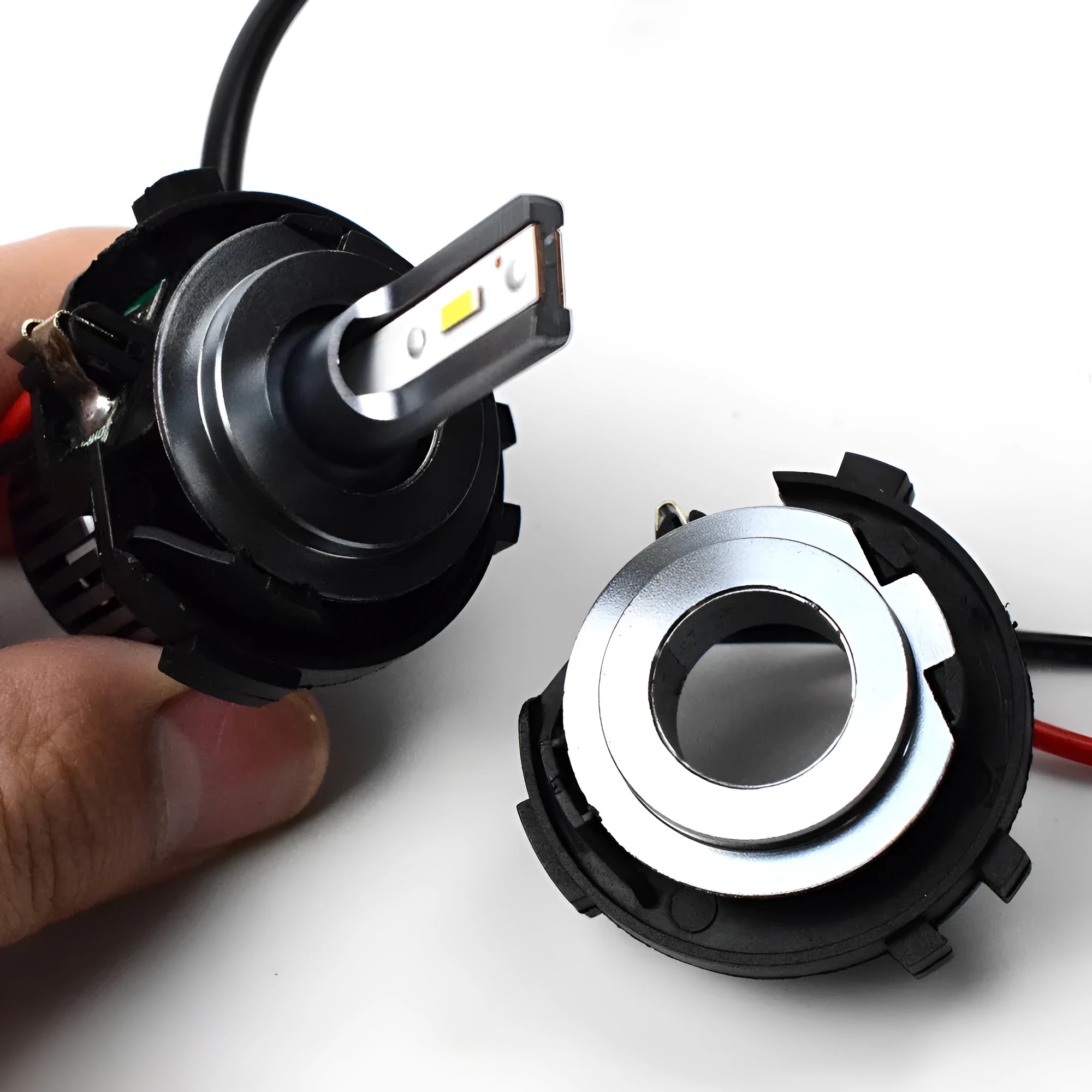 Black H7 LED bulb conversion adapter bracket for Volkswagen Golf, GTI, and Jetta models