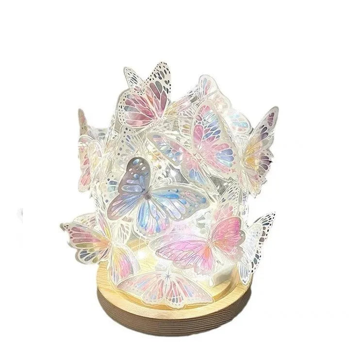 Butterfly shaped night lamp with glass shade on raw wood base measuring 12x15cm