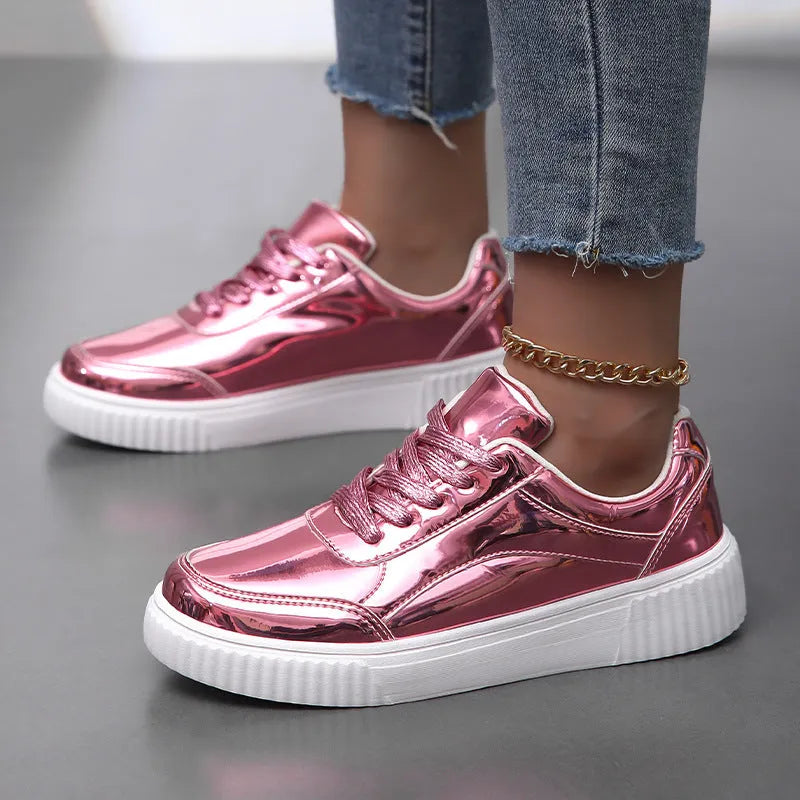 Rose gold sequinned platform sneakers with round toe and thick MD sole on a white background