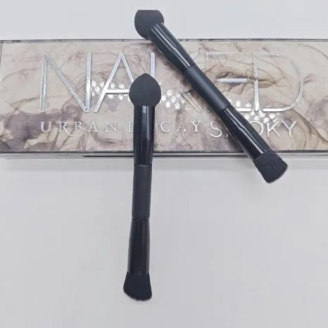 Double-headed makeup brush with black miter sponge and artificial fibre bristles on wooden handle