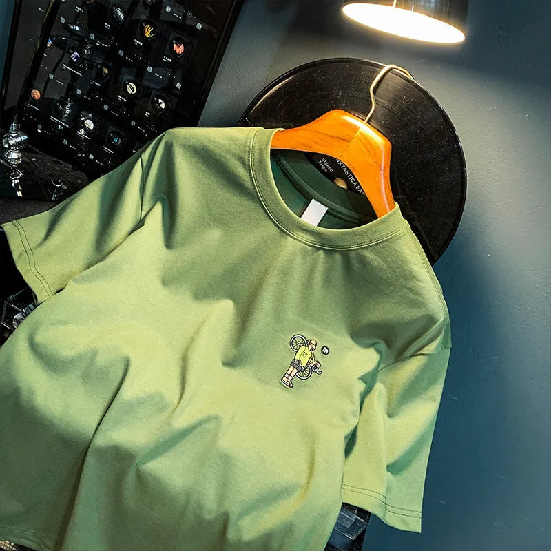 Green loose fit men's printed t-shirt with short sleeves on hanger