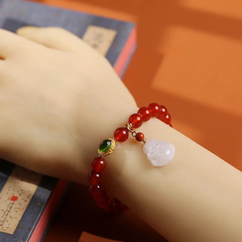 Red agate bracelet with amber accents and geometric Maitreya Buddha charm