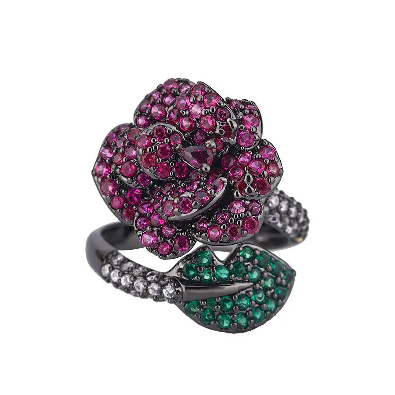 Women's geometric flower ring in black gold with simulated red corundum stone on gold-plated copper band