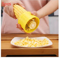 Yellow manual corn grinder thresher with corn-shaped design and PP handle.