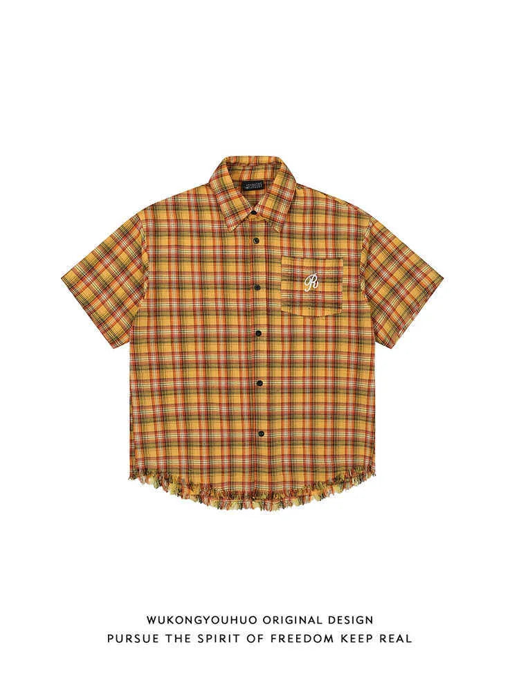 Yellow and white plaid short sleeve shirt with embroidery detail on chest pocket.