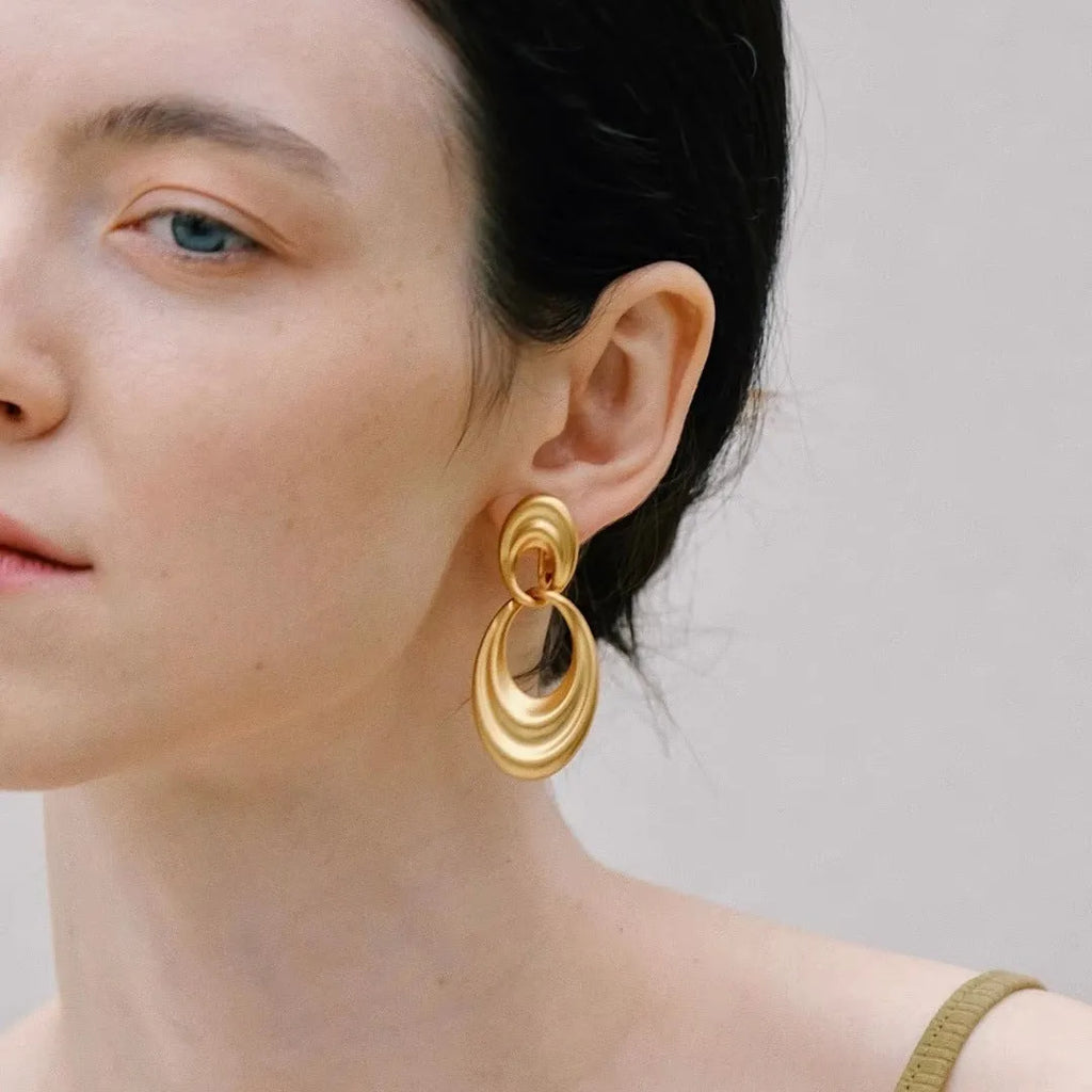 Double circle French retro earrings in plain gold finish with copper construction
