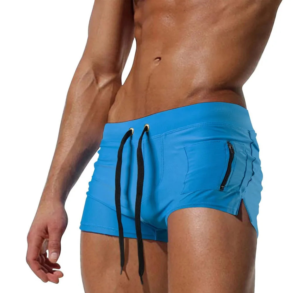 Men's black polyester high waist swimming trunks with lace-up front closure.