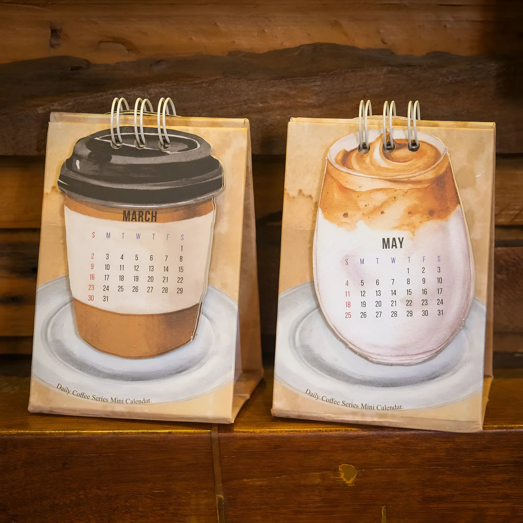Mini 2025 desk calendar set showing four different themed designs including coffee and motivational messages.