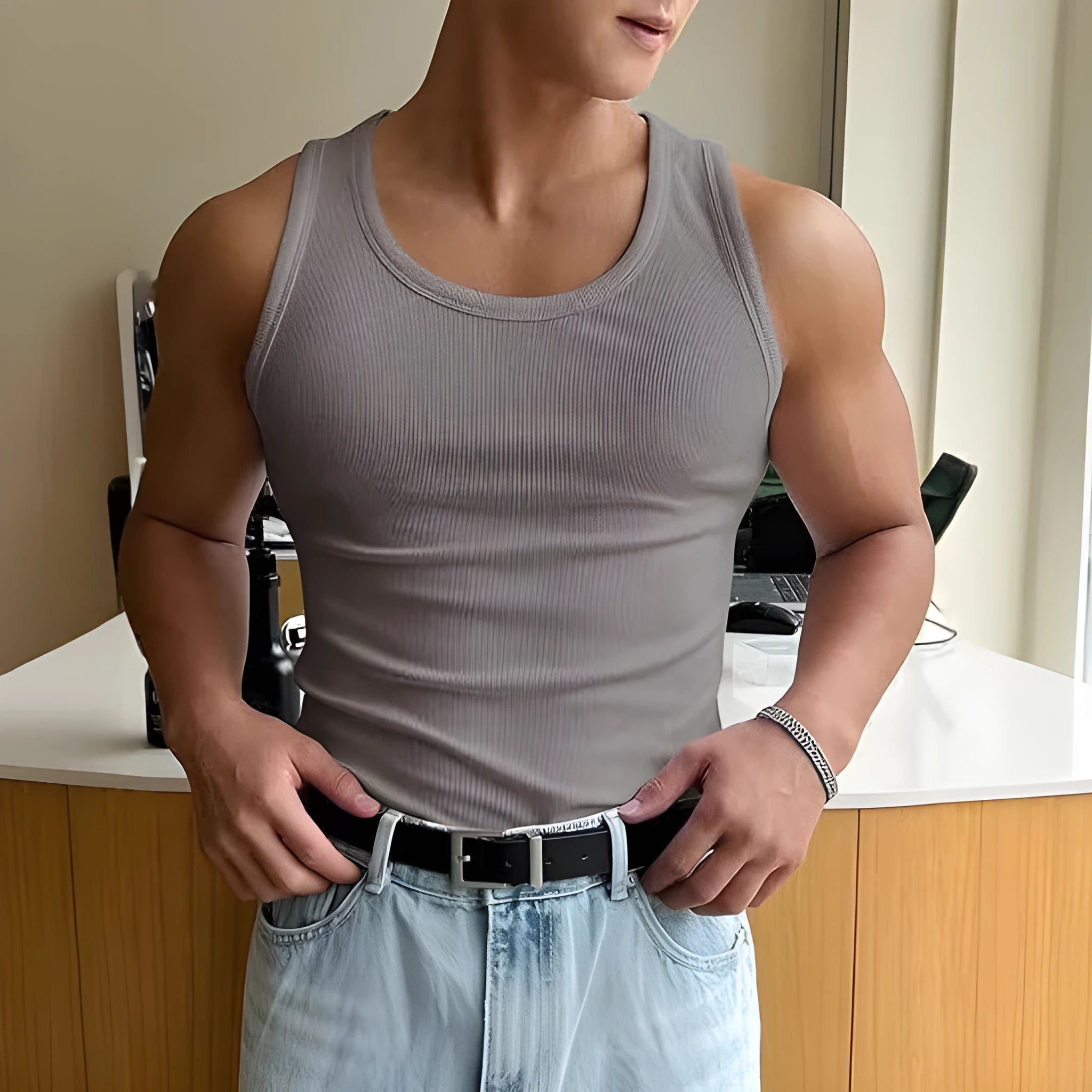 Men's tight fit polyester workout T-shirt with wool lining in various colours on a hanger.