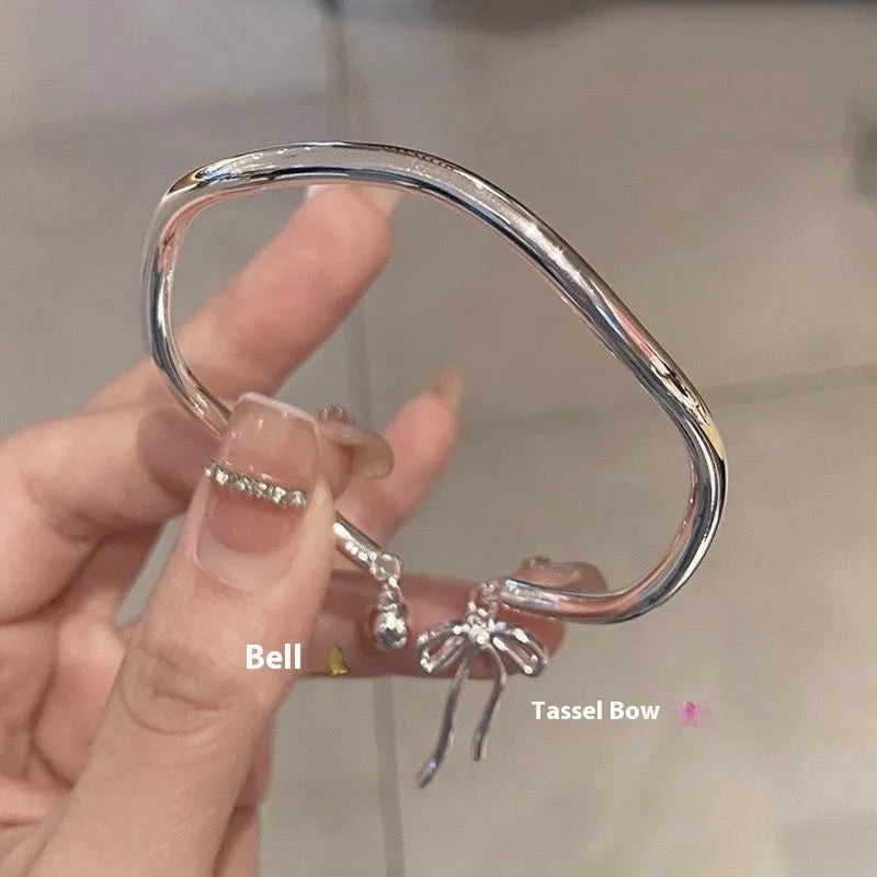 Silver adjustable bow bell opening bracelet made from zinc alloy