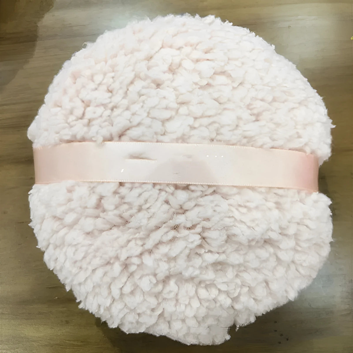 Large rectangular white plush powder puff for dry makeup application