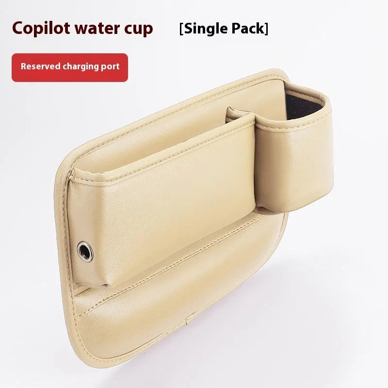 Car seat gap storage box in black leather with built-in water cup holder, fitted between driver seat and centre console