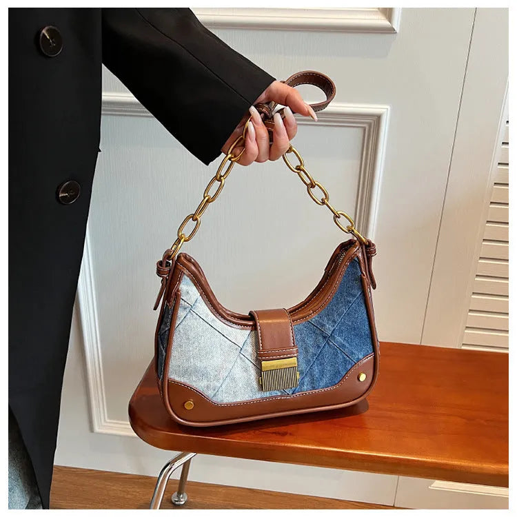 Brown denim bucket shoulder bag with diamond mesh panels and metallic chain strap