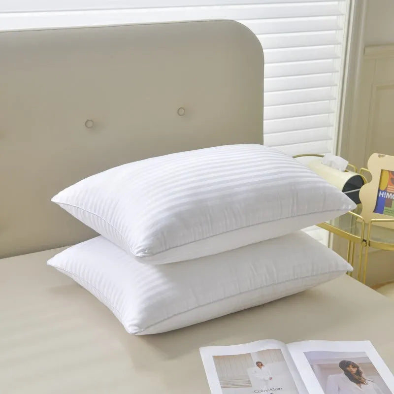 White cotton satin stripe feather pillow with duck down filling showing striped fabric detail