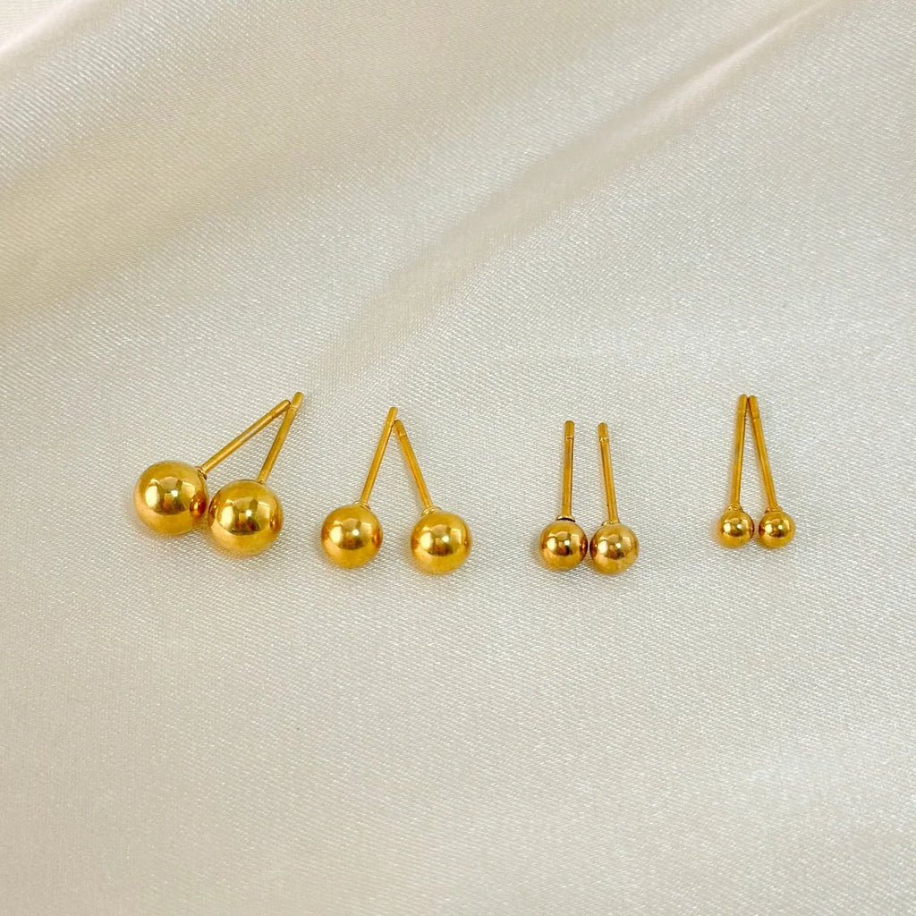 Stainless steel round ball stud earrings in gold or silver, showing 3mm, 4mm, 5mm, and 6mm size options.