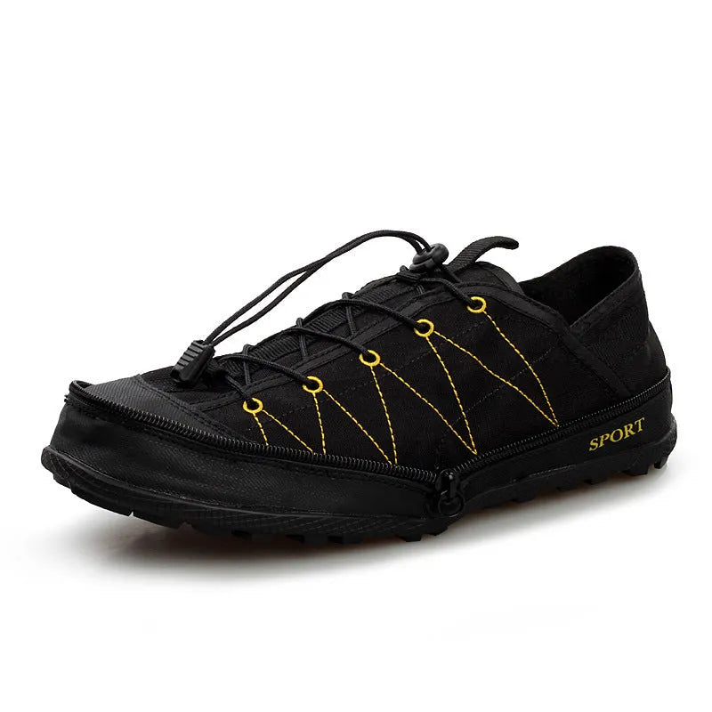 A pair of orange folding outdoor hiking shoes with a mesh upper and a prominent side zipper, shown in a collapsed state.